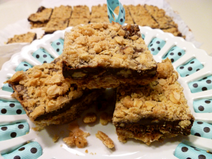 oatmeal turtle bars on cake stand