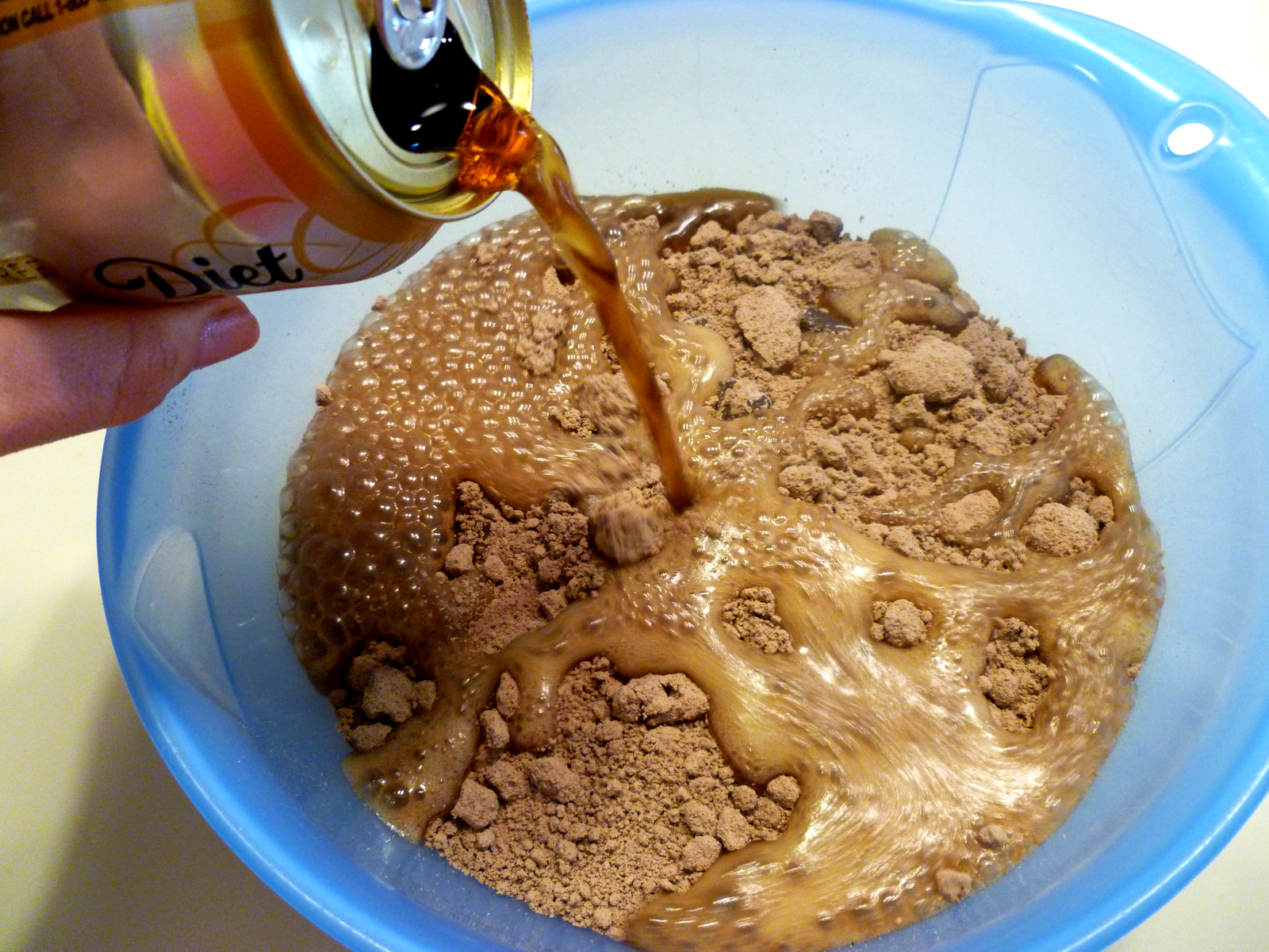 pouring can of Coke into brownie mix