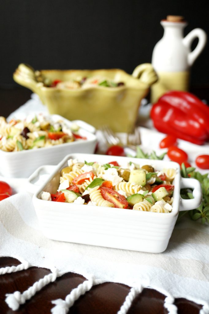 Dishes with greek pasta salad.