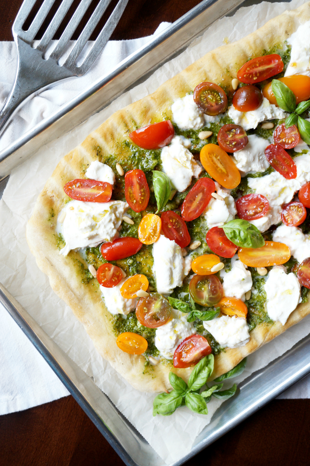 grilled pizza with pesto, burrata, and baby tomatoes | The Baking Fairy