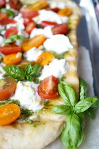 grilled pizza with pesto, burrata, and baby tomatoes | The Baking Fairy