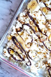 banana, hazelnut, and dark chocolate popcorn snack mix | The Baking Fairy #NewYearLessEvil #ad