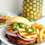 vegan aloha burger topped with grilled pineapple and jalapeño slices