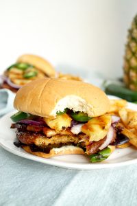 vegan aloha burger with a bite taken out of it