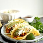 BBQ chickpea tacos topped with coleslaw and avocado on a plate