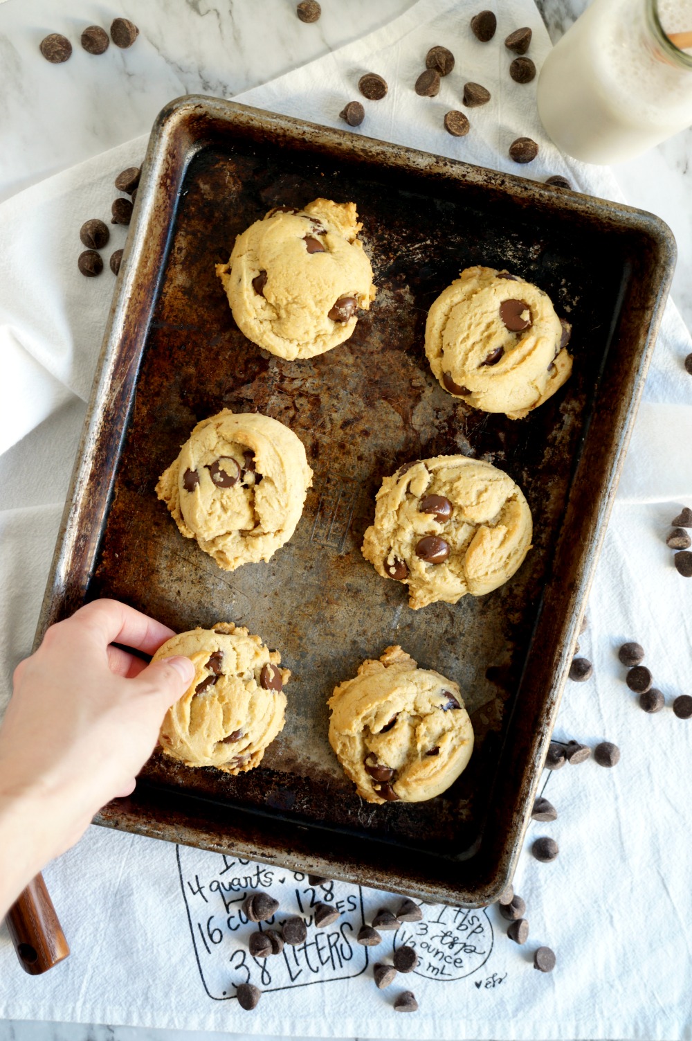 overhead shot of hand grabbing a cookie