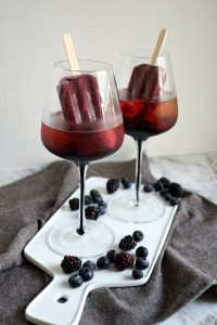 wine glasses with popsicles