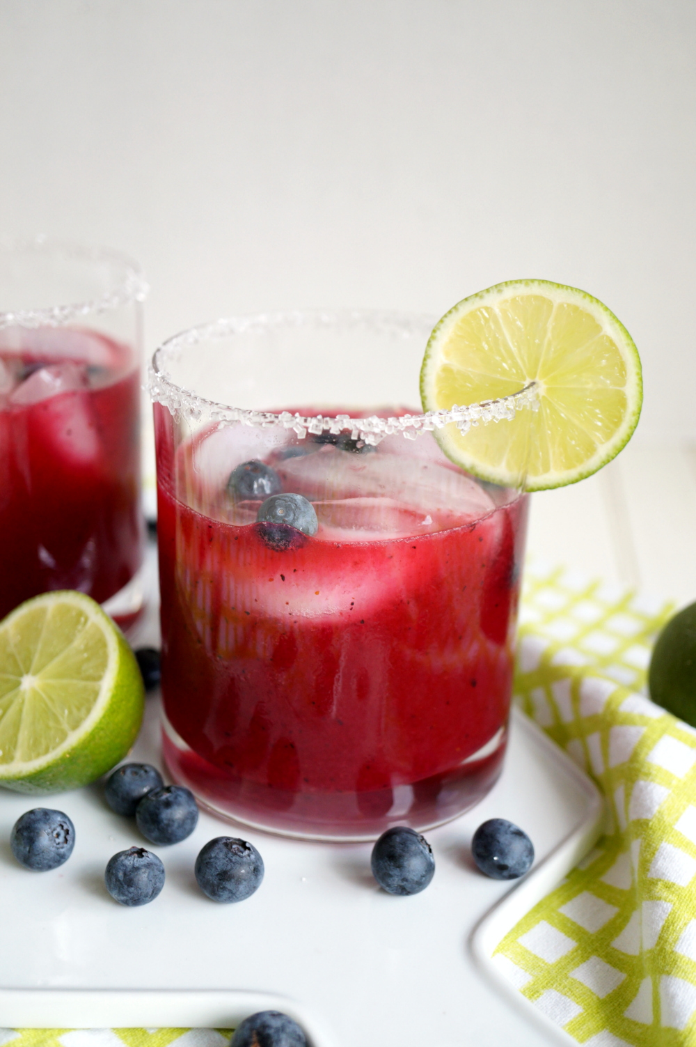 a cup of blueberry lime margarita