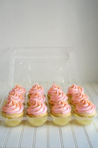 pink cupcakes in a carrier