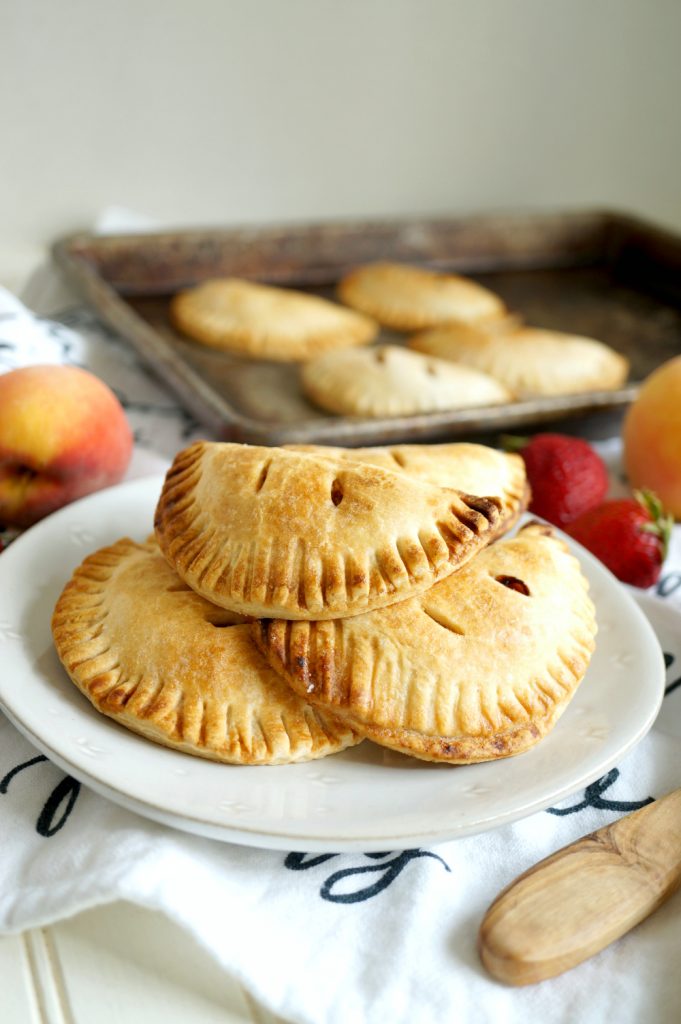 strawberry peach hand pies on a plate