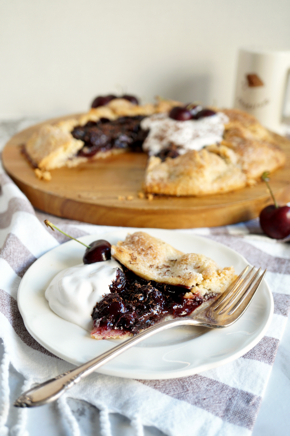 slice of chocolate cherry galette on a plate