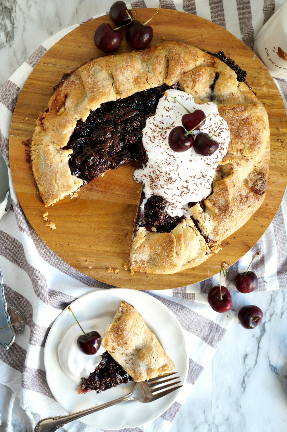 overhead of sliced chocolate cherry galette