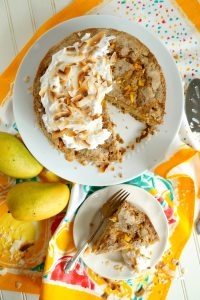 overhead of mango coconut snack cake with slice