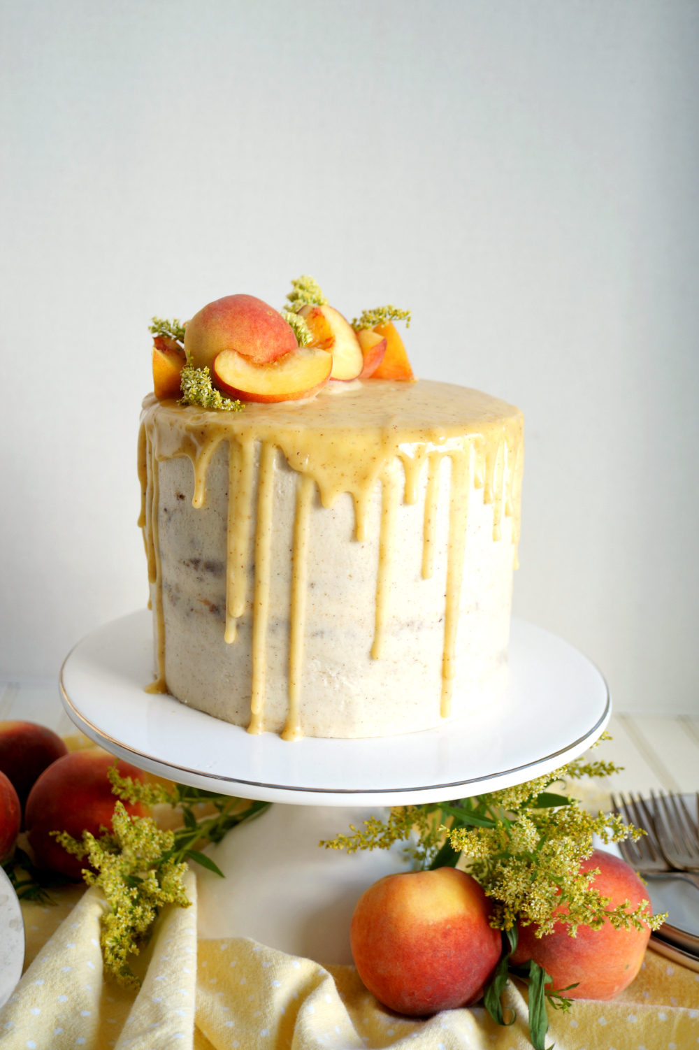 peaches & cream layer cake on stand