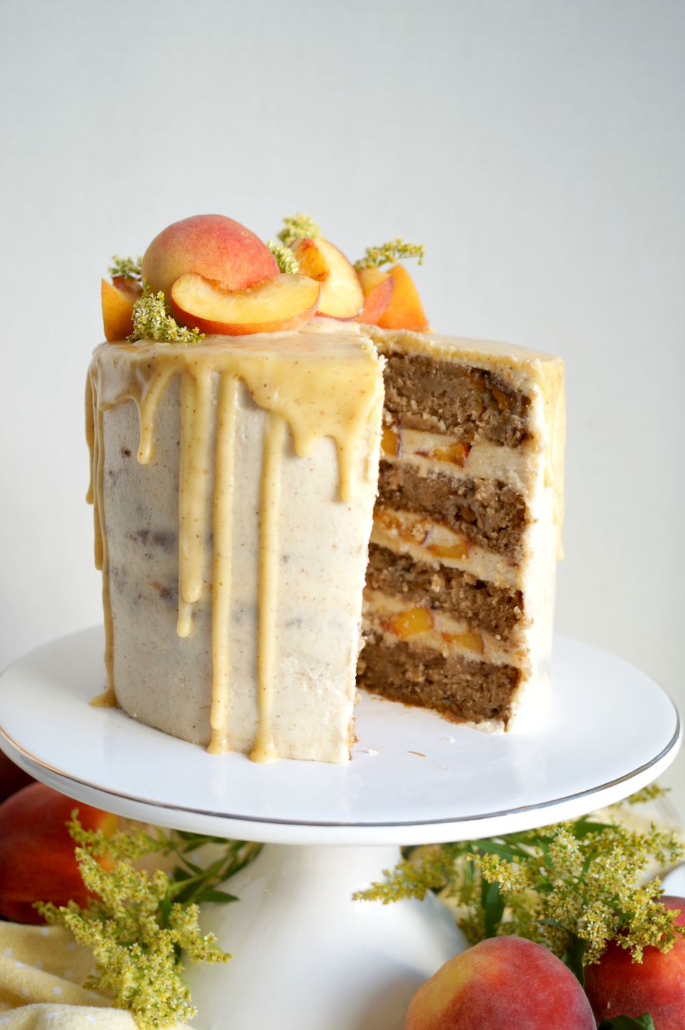 peaches & cream cake with slice cut out