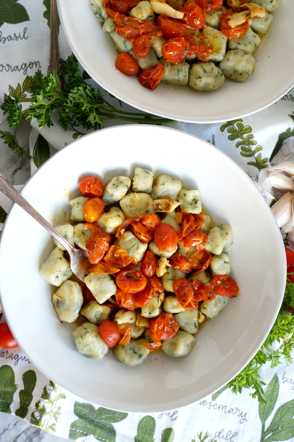 plate of spinach gnocchi with tomato sauce