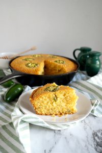 slice of cornbread in front of pan