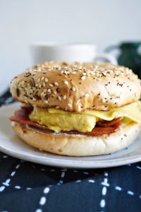 close up of breakfast bagel sandwich