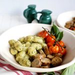 plate of gnocchi with sausage and tomatoes