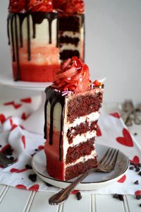 cut slice of red velvet chocolate chip cake