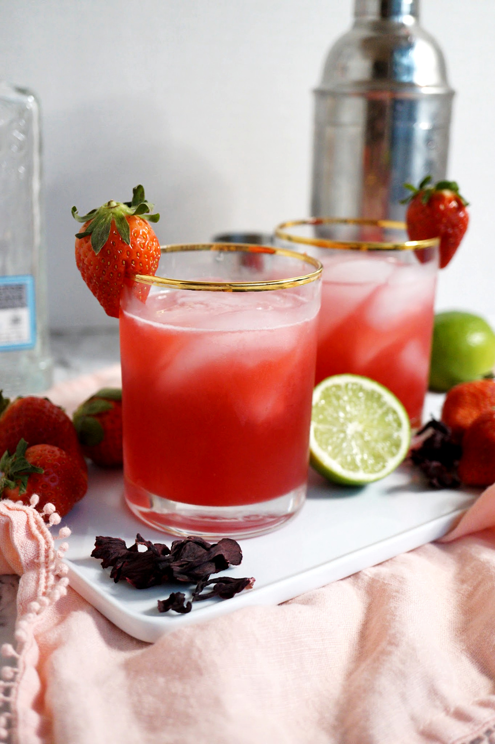 two glasses of strawberry hibiscus margaritas