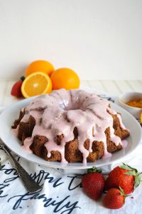orange poppyseed bundt cake with strawberry glaze