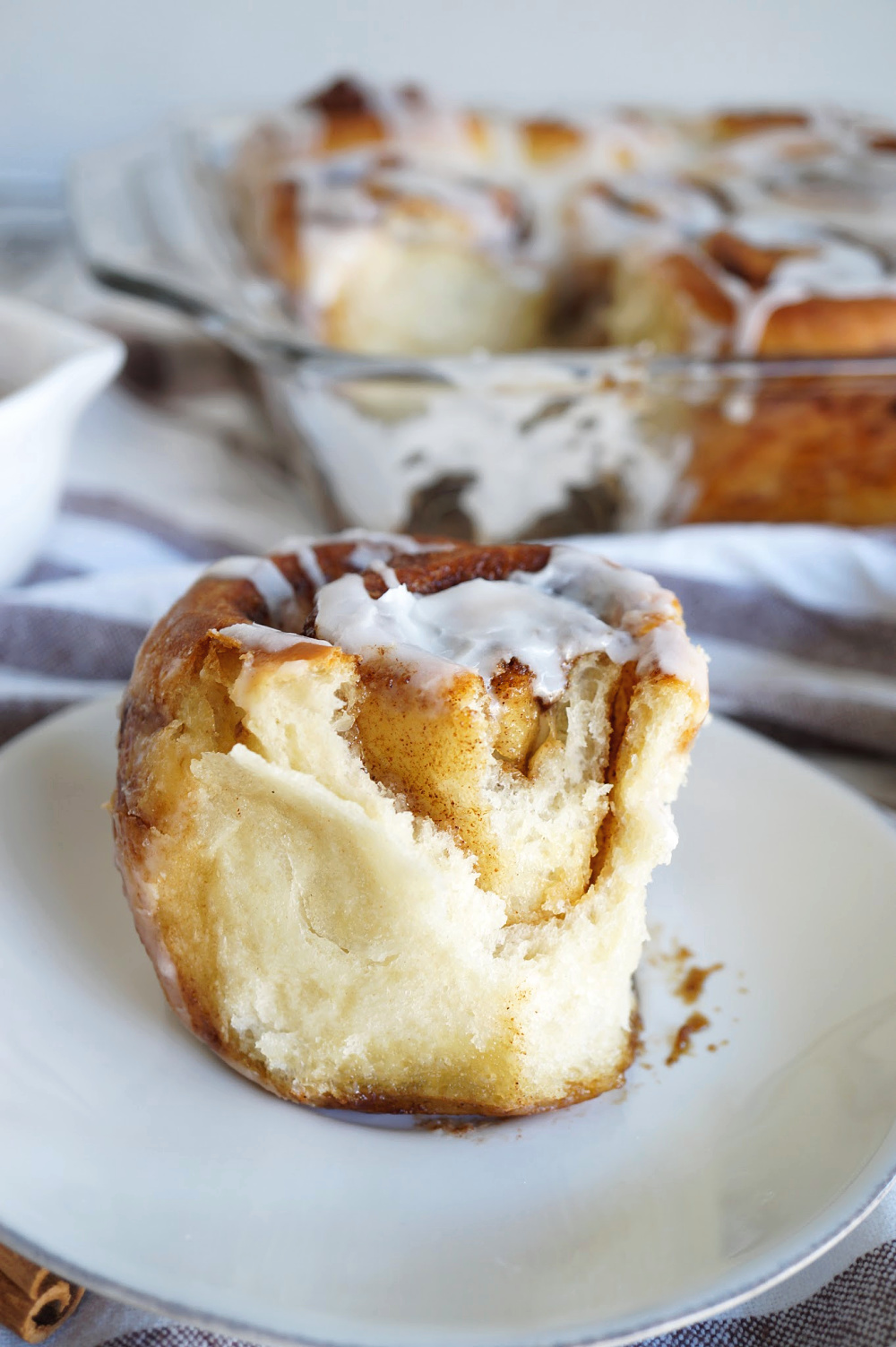 single cinnamon roll with bite