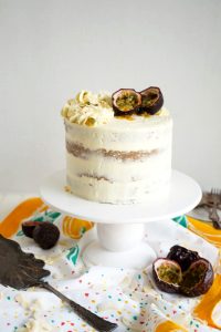 coconut layer cake with passionfruit curd on cake stand