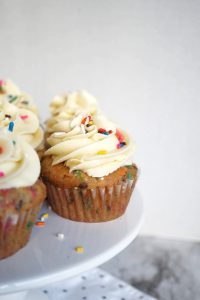 white cake cupcakes on stand