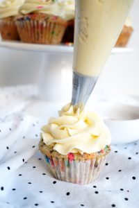 frosting a cupcake