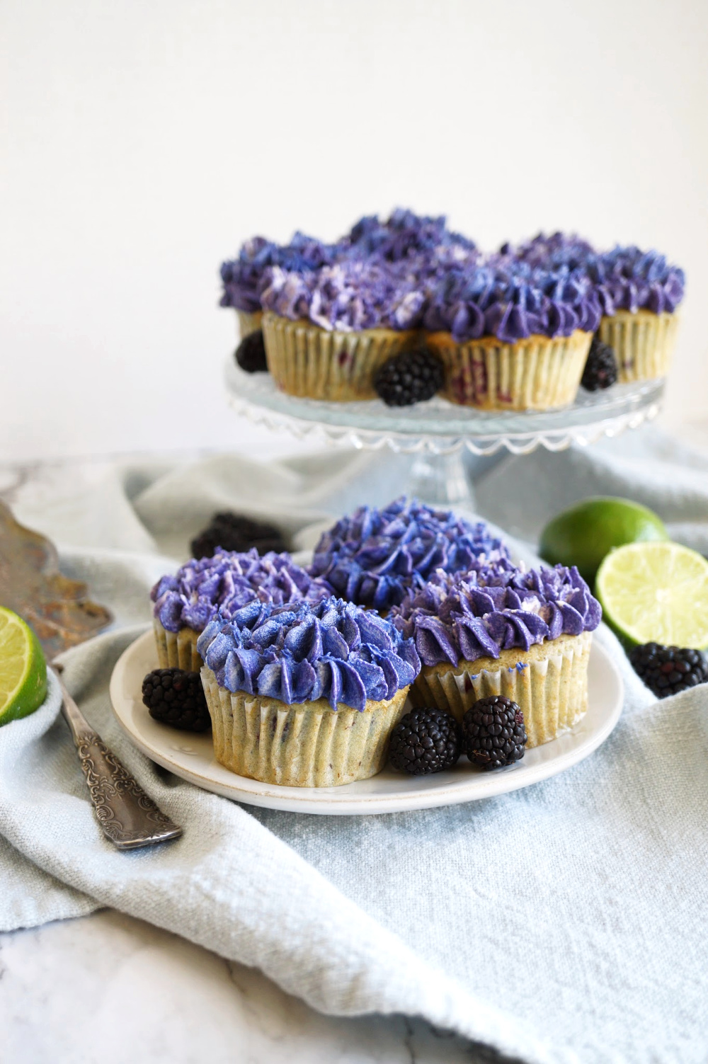 blackberry lime cupcakes on a plate