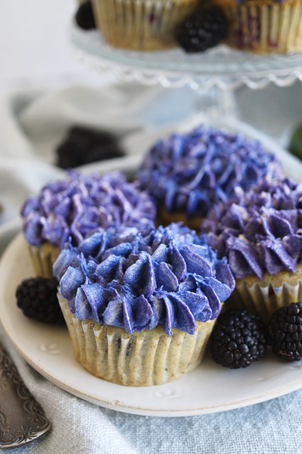 close up of a cupcake with hydrangea frosting