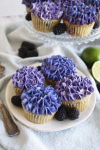 blackberry lime cupcakes on a plate