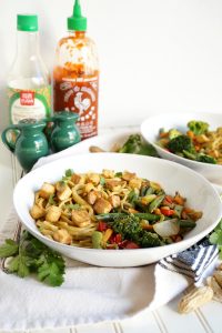 plate of peanut noodles with vegetable stir fry