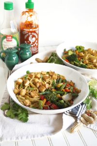 bowl full of noodles with tofu and vegetables