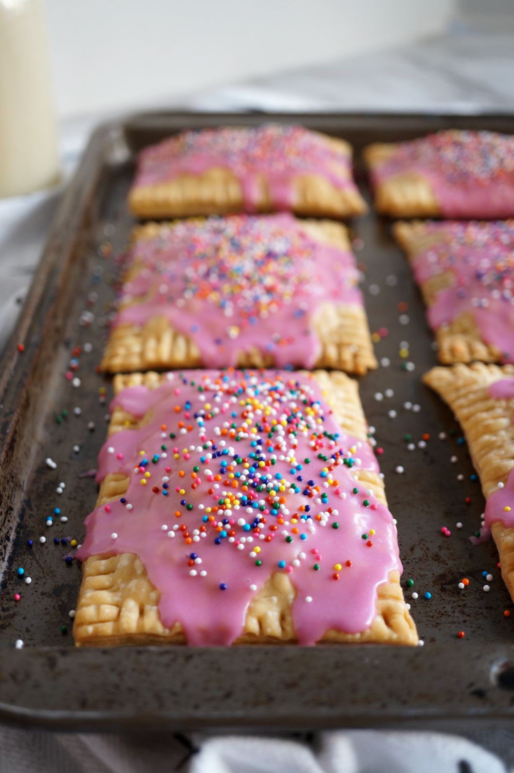 row of strawberry pop tarts on baking sheet