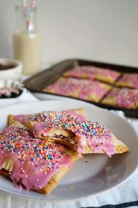 strawberry pop tarts on plate with bite missing