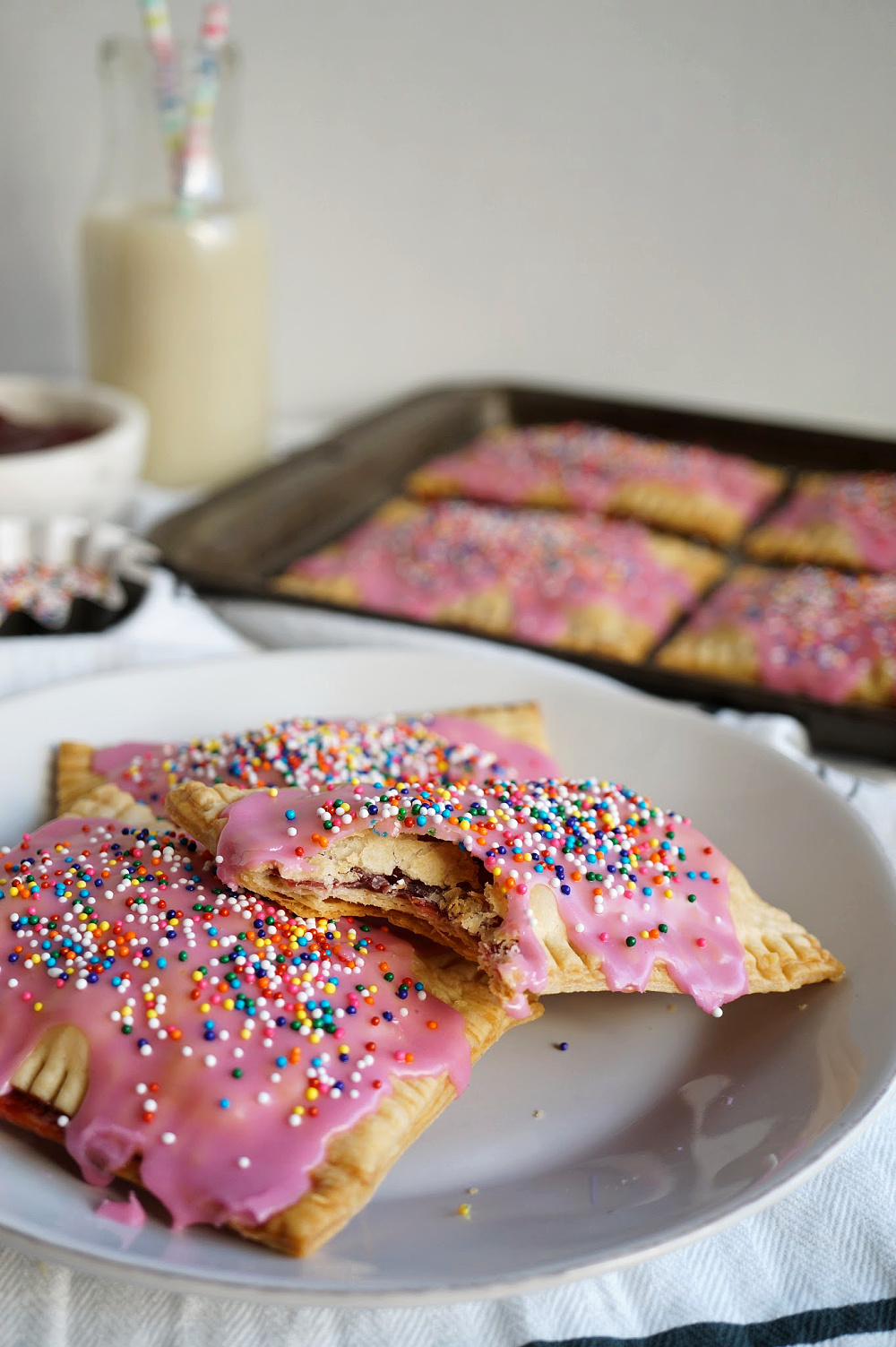 strawberry pop tarts on plate with bite missing