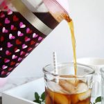 pouring cold brew into cup