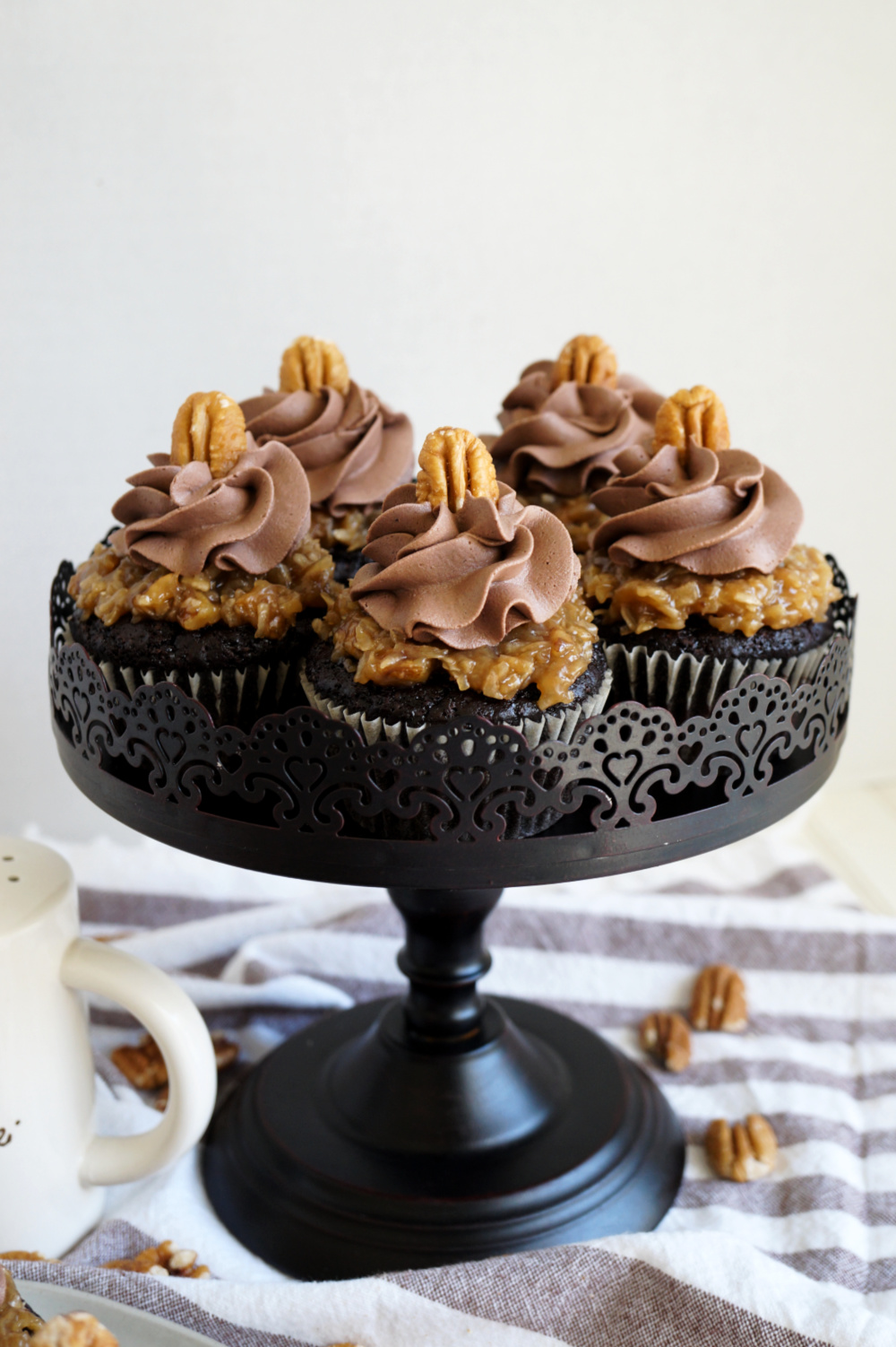 cake stand of vegan german chocolate cupcakes