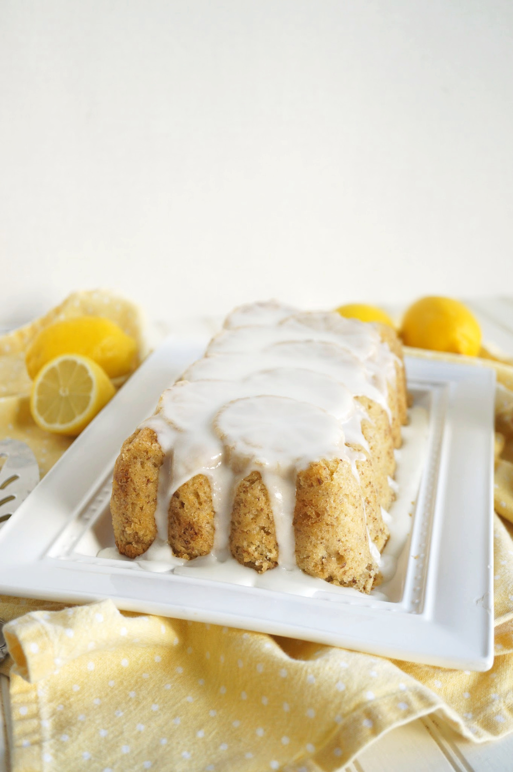 glazed lemon loaf on tray