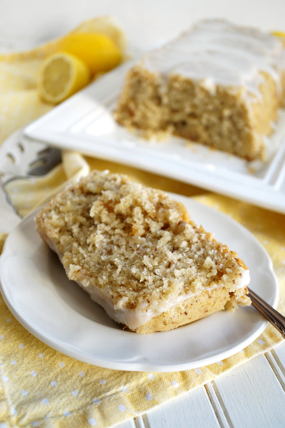 slice of lemon ginger loaf cake on plate