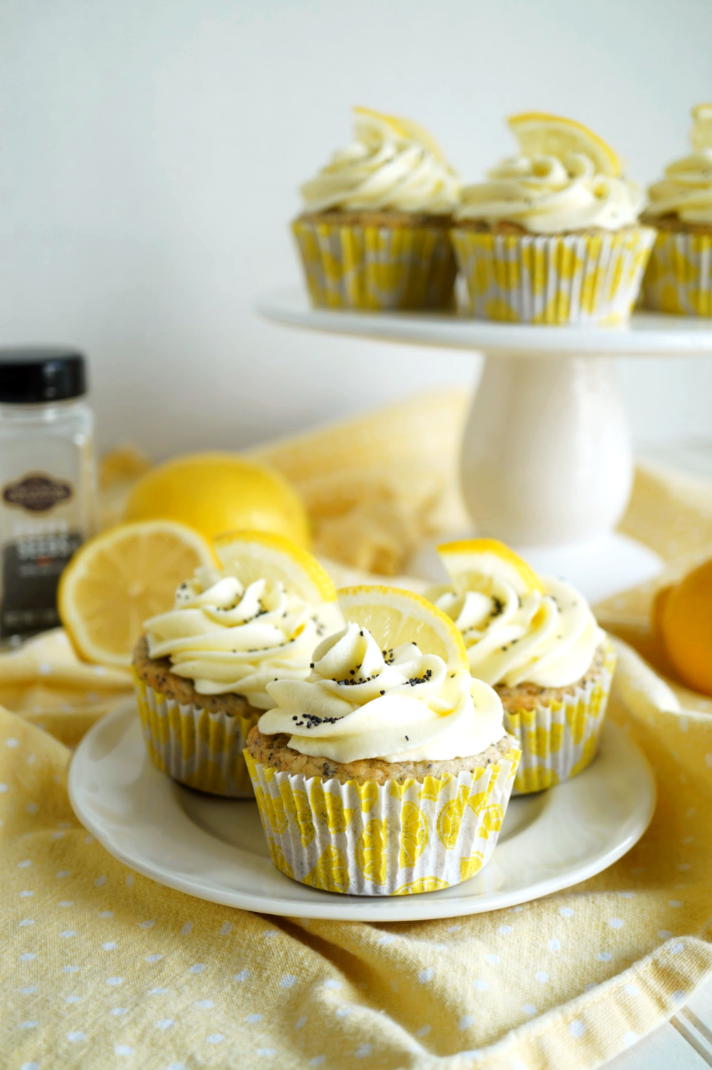 vegan lemon poppyseed cupcakes on a plate