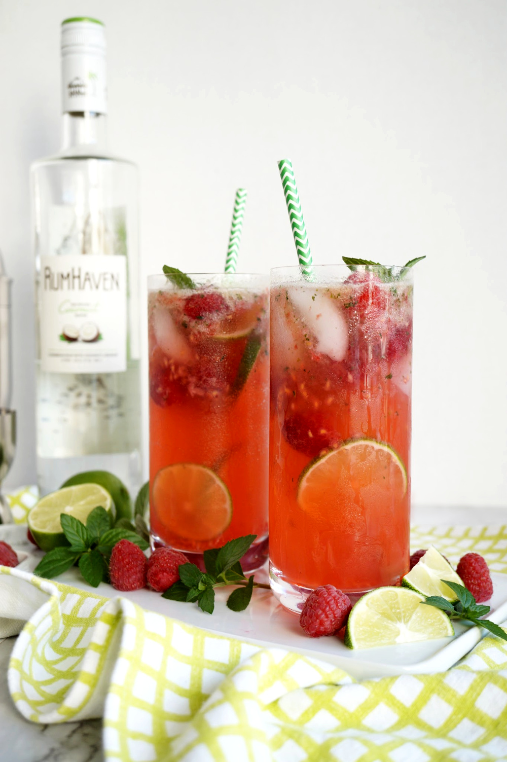 two glasses of raspberry coconut mojitos