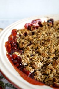 close up of crumble oat topping on strawberry crisp