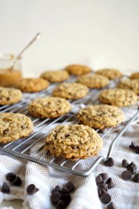 peanut butter banana chocolate chip cookies on cooling rack