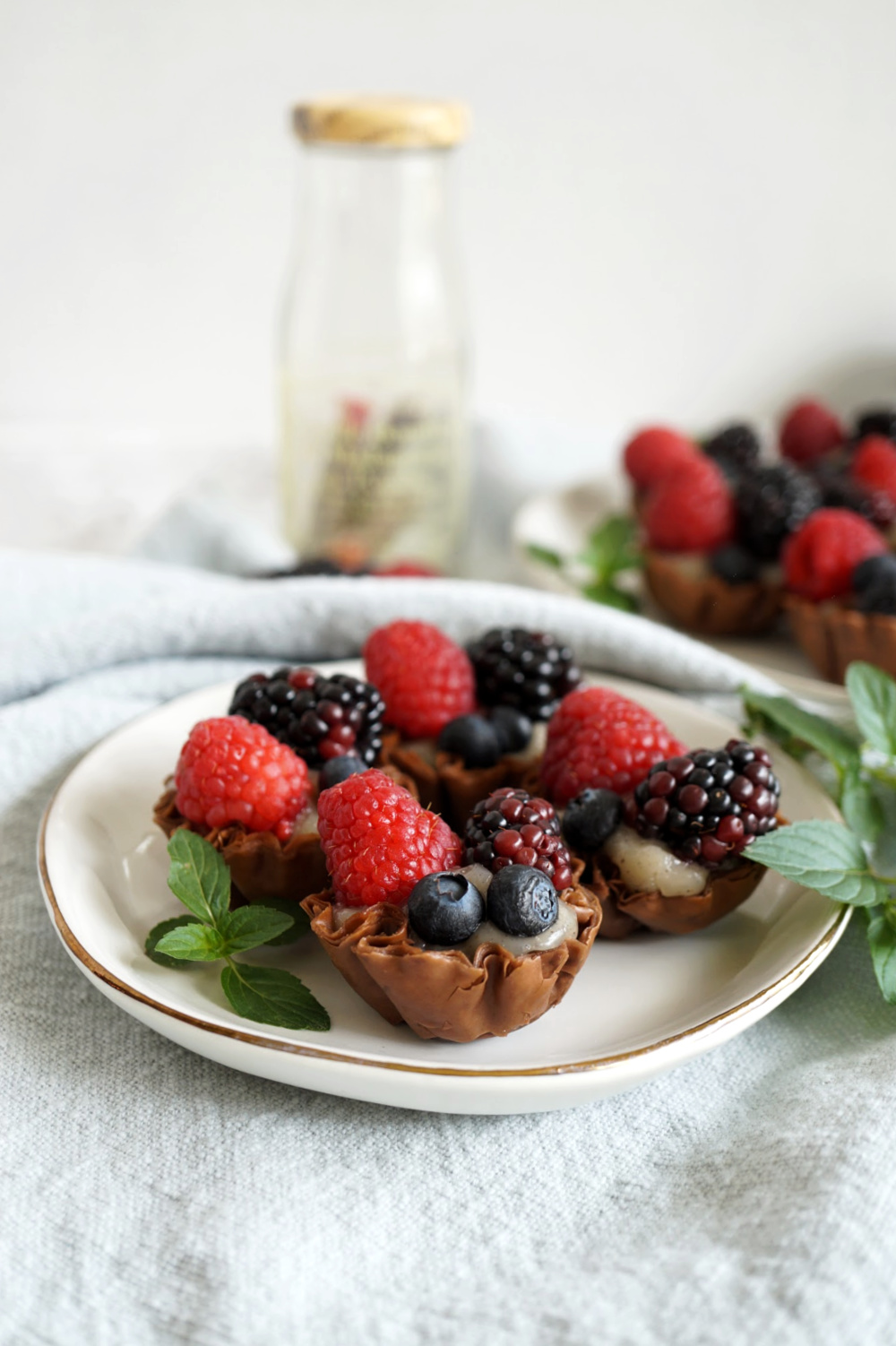 several berry tarts on plate