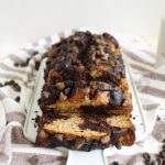 marble banana bread sliced on a cutting board