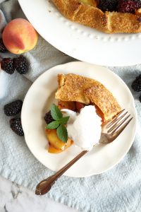 overhead photo of a slice of galette with ice cream and mint