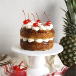 vegan pineapple upside down layer cake on cake stand